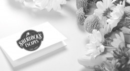 Sherlock's Escapes card and flowers