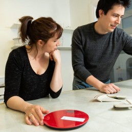 Man and woman working on puzzle in escape room