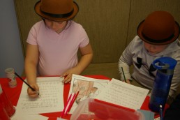 Children working on puzzles in escape room